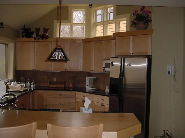 Kitchen with wood cabinets and a breakfast island