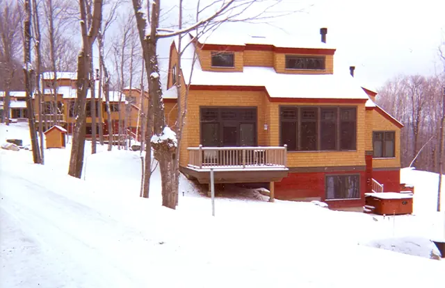 Multi-story home on a snowy slope