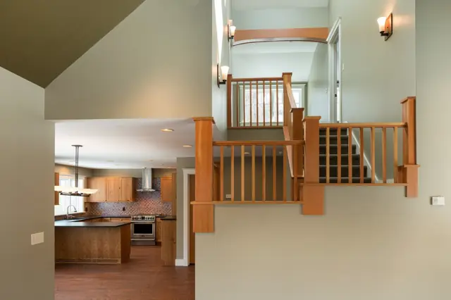 Open stair and balcony overlooking the kitchen