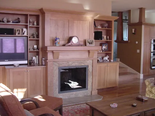 Living room with built-in shelving around a fireplace